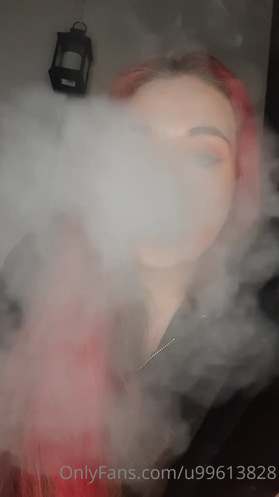 Smoking close up and blowing smoke into the camera 