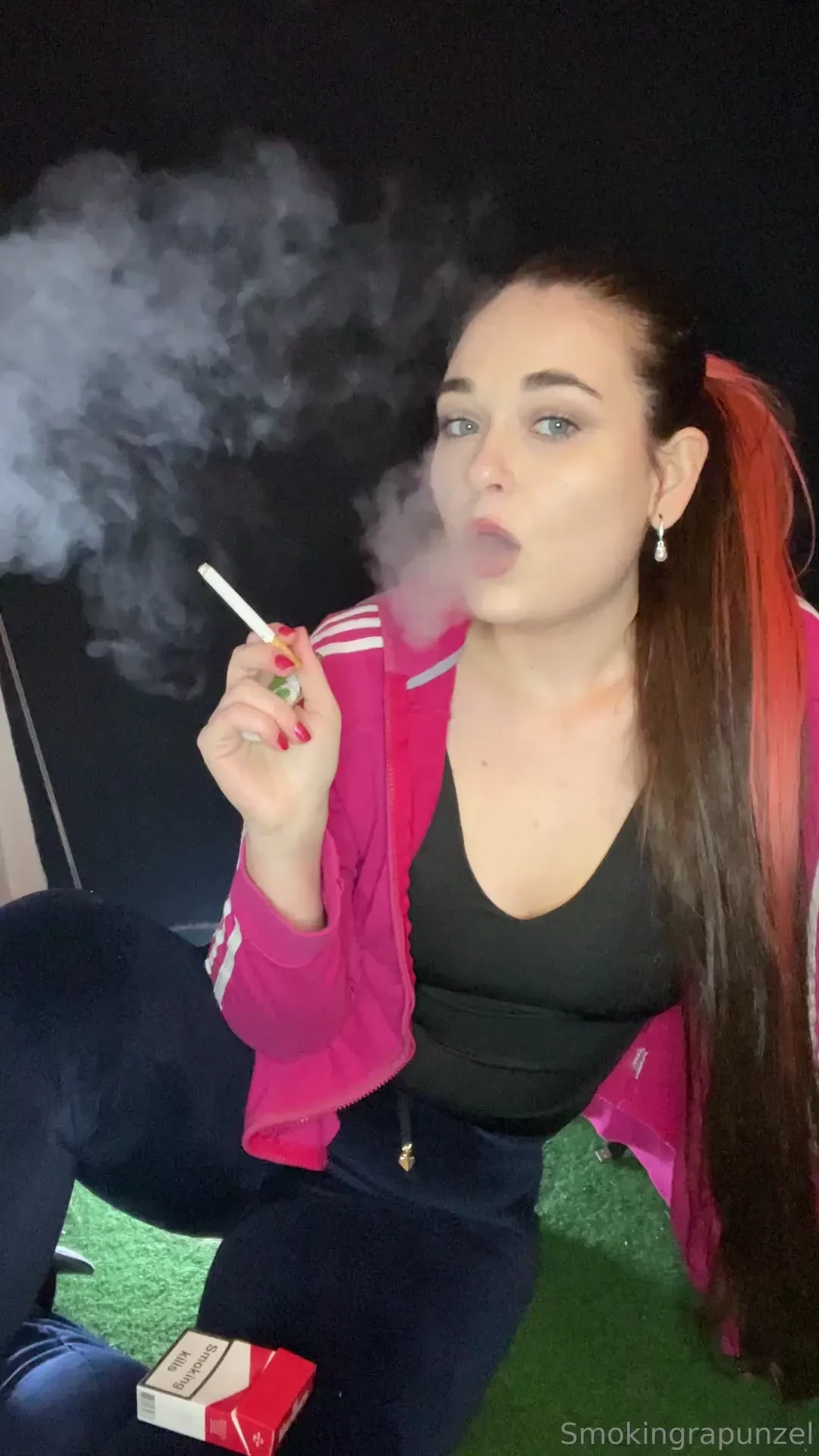 Blowing big clouds dangling french inhales nose exhales blowing smoke 