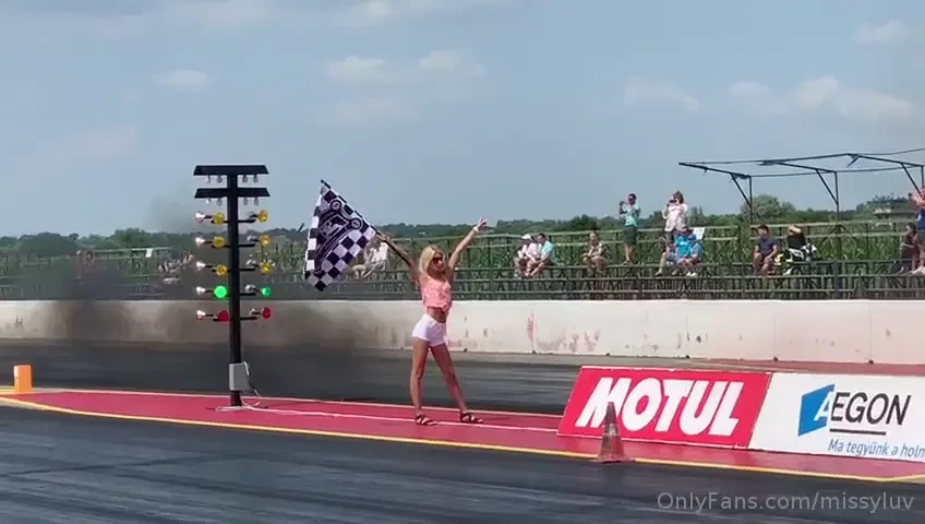 Look who s that badass flag girl in the race field 