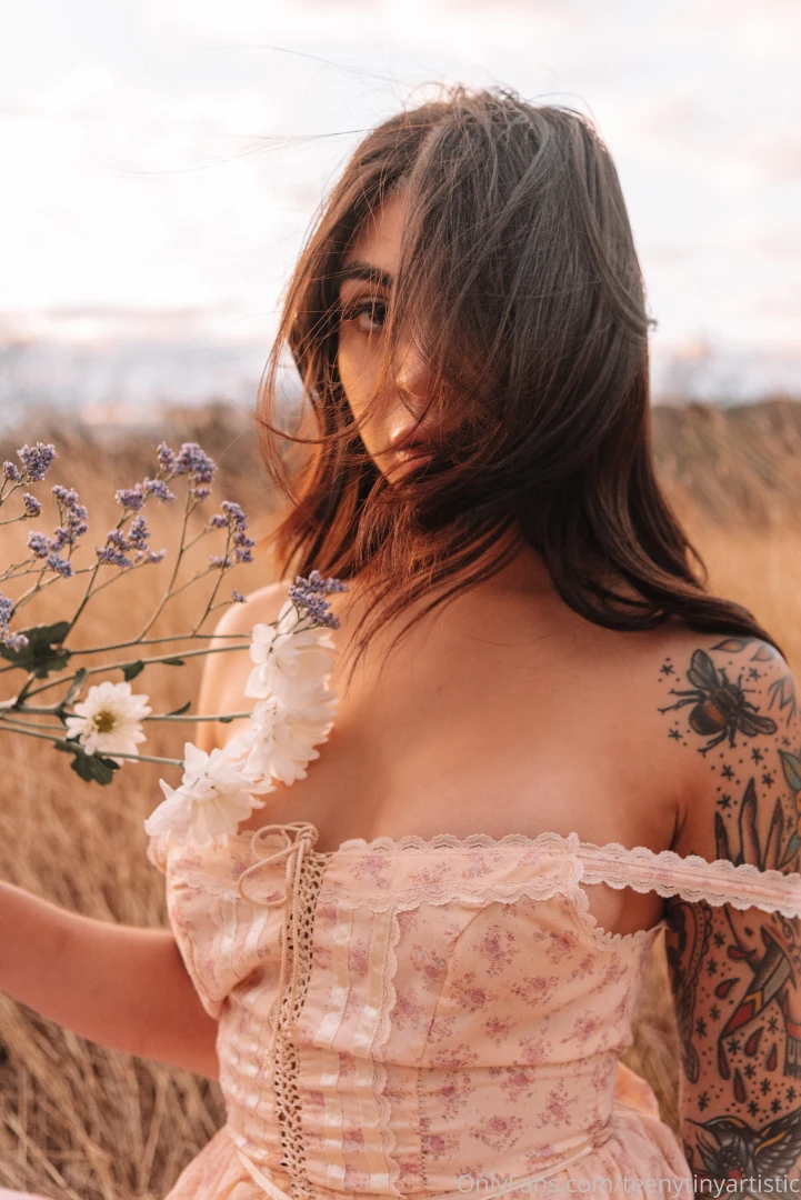 Pretty flowers and a pretty babe how you doin today 