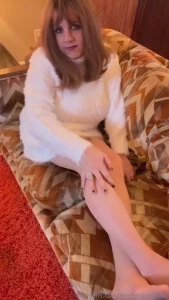 Smooth legs in nylons and a fuzzy dress