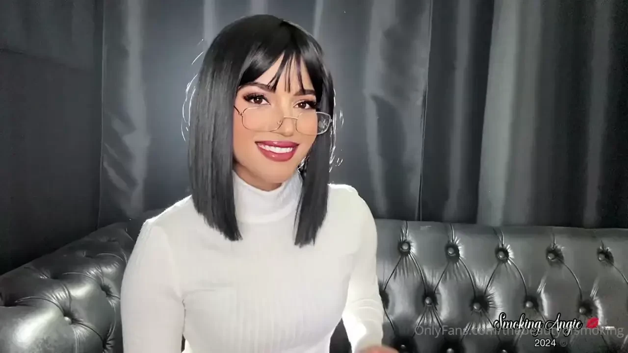 Lovely short black hair smoker in glasses and white turtle neck 