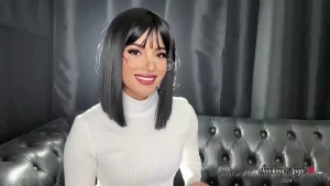 Lovely short black hair smoker in glasses and white turtle neck