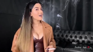 Brown leather low cut dress brown leather jacket long nails nude