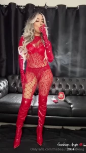 Blonde bimbo doll smoking marlboro red 100s wearing a red lace