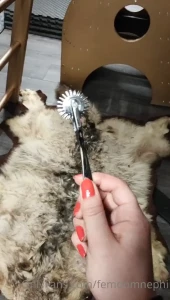 Tracing this pin wheel across your skin leaving little stab marks as i