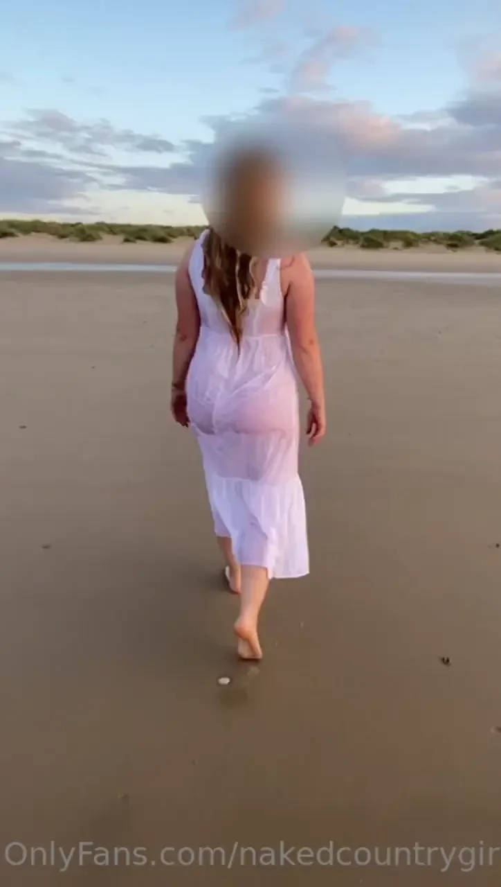The fun of having an early morning walk in the sea in a white dress 