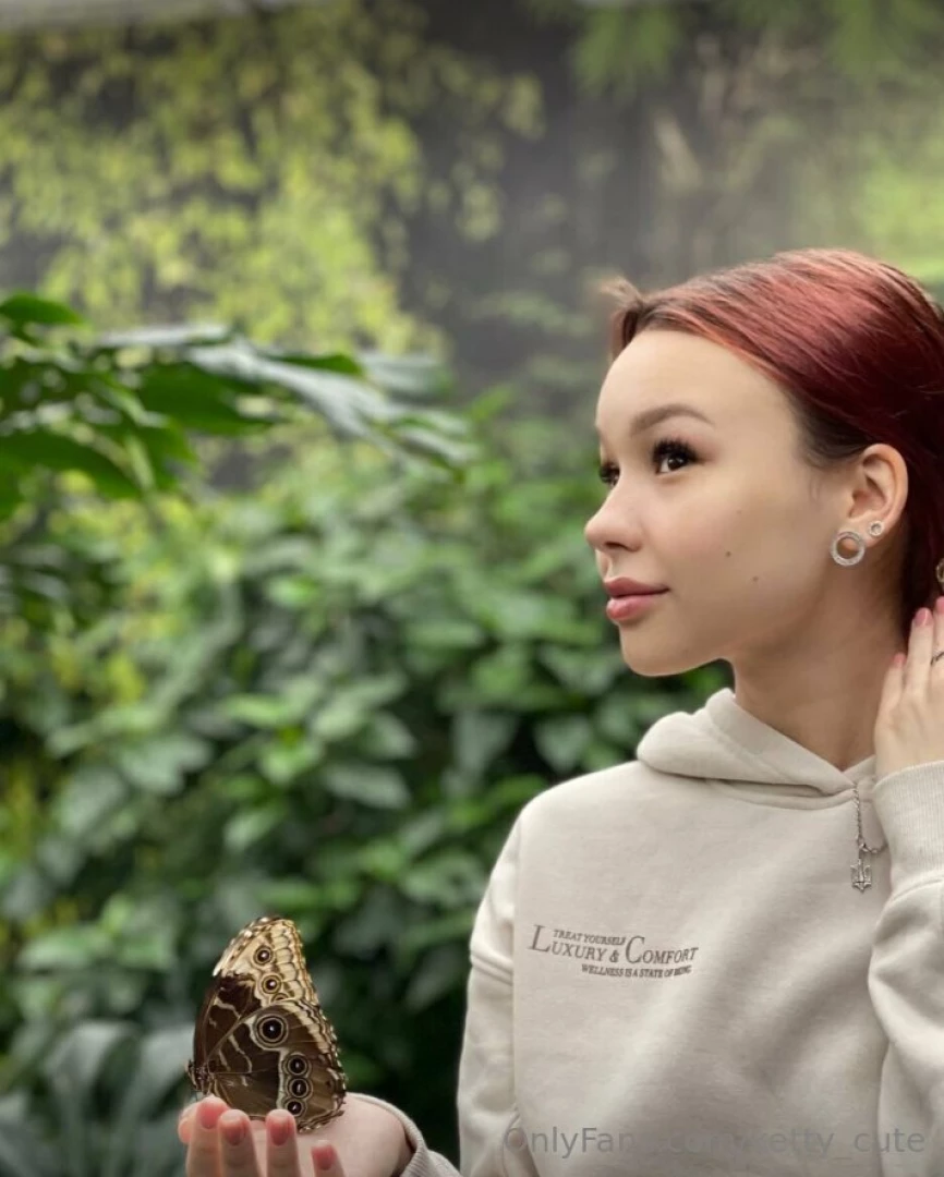 Cradling a delicate butterfly in my hands a tiny dance of grace and 