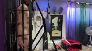 I lock slave up in my body cage and clamp his nipples together outside