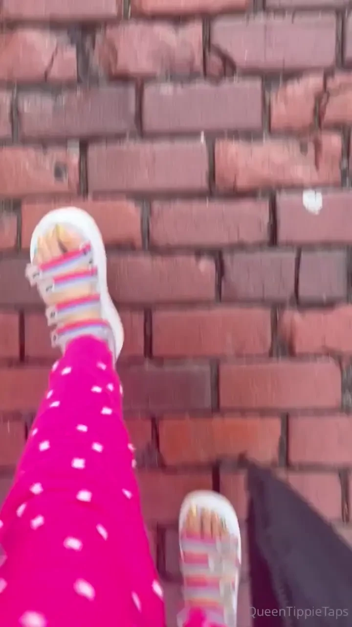 Walking in sweater pants and sandals 