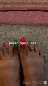 Long rainbow toenails scratching the carpet