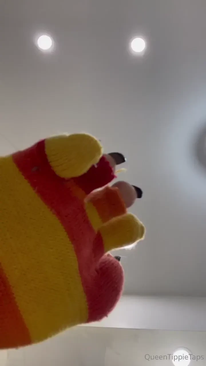 Holes and stripes long black toenails 