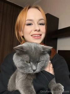 Two moods in one photo me bringing all the smiles and my cat serving