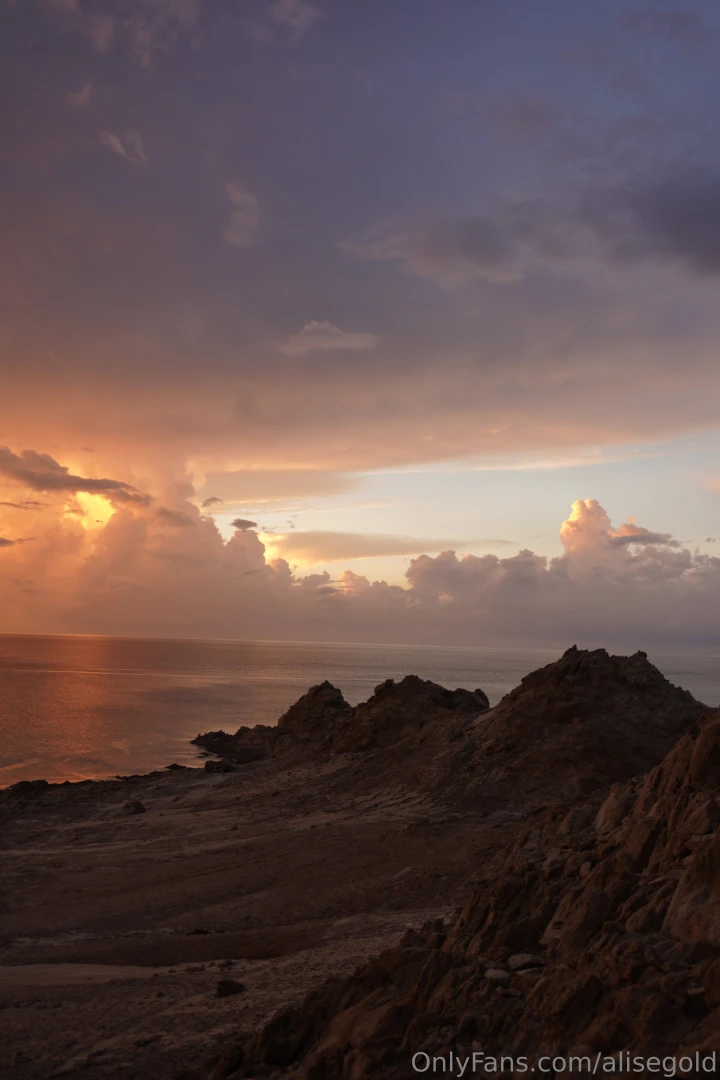 In the evening as the sun sets over the horizon the sky is colored in 