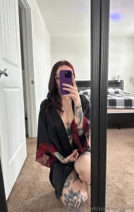 4 mirrors placed up on the wall to make content in