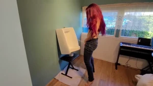 Mastering my aim at the urinal pissing through the fly of my jeans