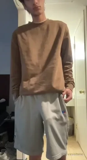 Walking around my dorm building with my bulge out in grey sweatshorts 