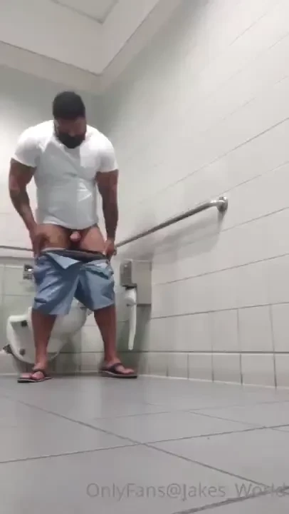 Busy airport bathroom spank off cumshot and clean up 
