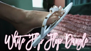 White flip flop dangle hd slip into deep thought and relaxation