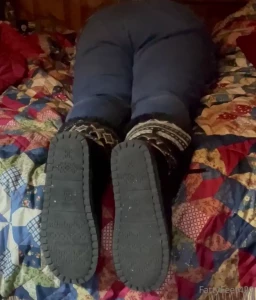 Kicking off my hot boots to show my dirty socks then my bare moist