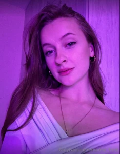 Soft purple light surrounds me creating an aura of mystery and