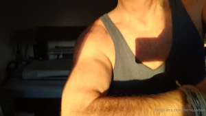 Hairymuscles biceps bicepspose in the sunlight