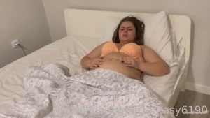 I lay in bed with only a bra on my bottom half of the body is covered