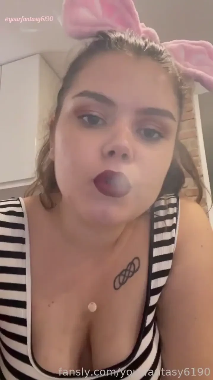 I wear an intense red matte lipstick i enjoy smoking a cigarette 