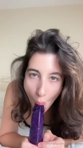 Watch me suck then fuck myself in bed with my purple dildo i love