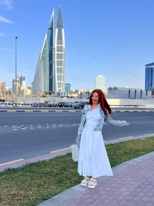 Immerse yourself in the city atmosphere in a white dress high-rises