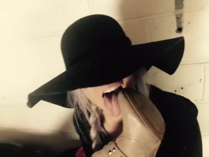 Licking dakota s boots