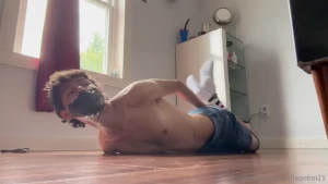 Hogtied with zip ties securing the wrists amp with tape binding my