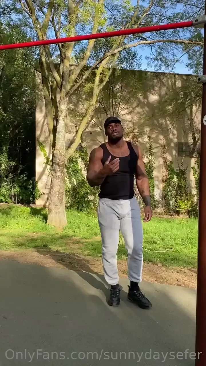 At the workout park doing pull ups 