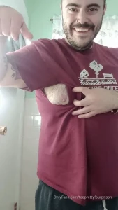 My hairy moob is peaking through ripped at the seams from my fat on my
