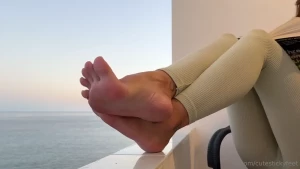 Secretly staring at my feet i am sitting on my balcony during sunset