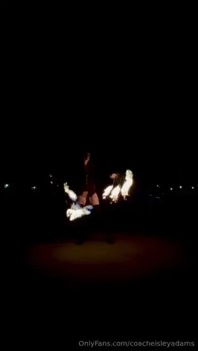 This is me spinning fire with four fans two in each hand just one in 