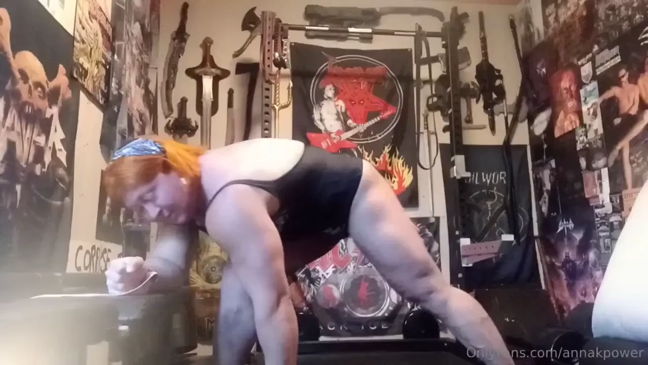 Dumbbell rows in a swimsuit 