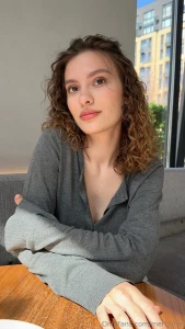 It s as if she s withdrawn from the hustle and bustle of the world to