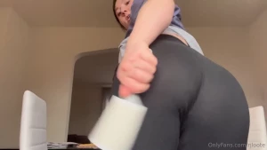 Filming prep lint roller humming a tune and booty shaking