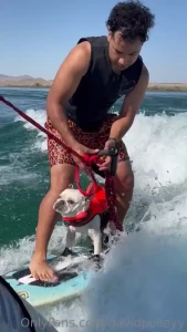 Here s a few photos of my wake surfing pup and i surfing on my boat
