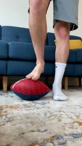 Watch me dominate this football with my sweaty feet pretend it s your