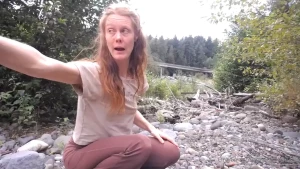 End of summer strip tease in public park area by bridge and cum and