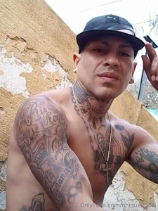 Tattooed dark-skinned latino with lots of things and ideas to fulfill