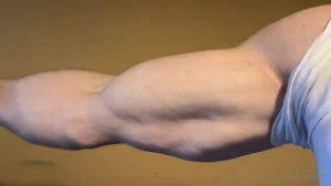 Big meaty biceps flexing