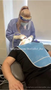 Amy in surgical gown visor and gloves giving a checkup and some part 1