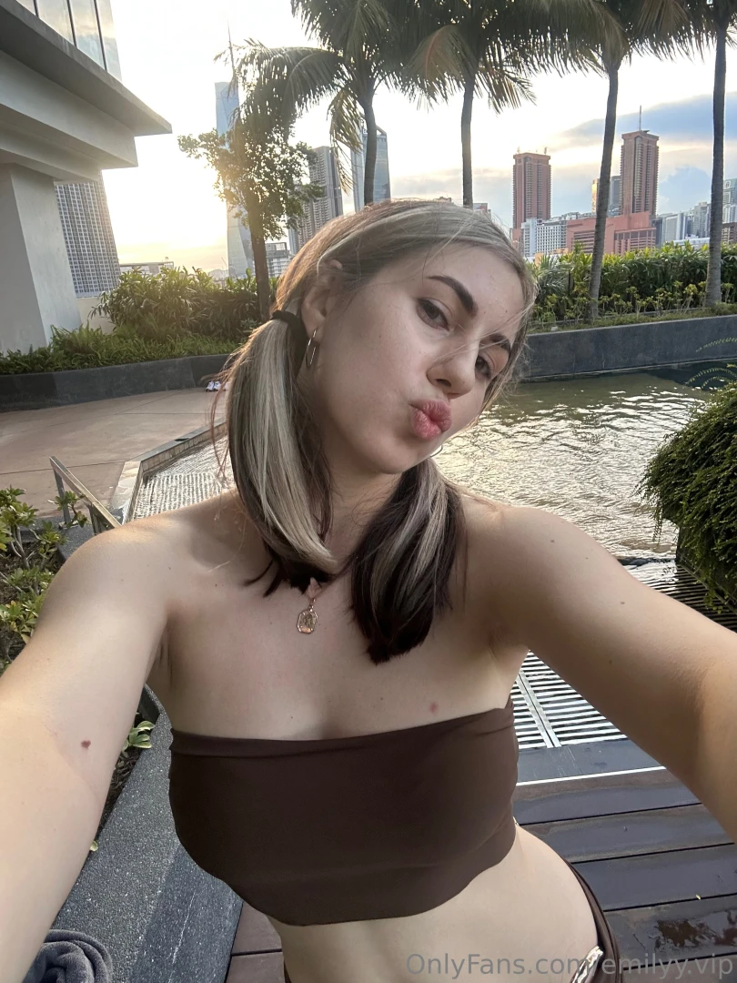 The sun kisses my skin my lips curl into a playful pout and my head is 