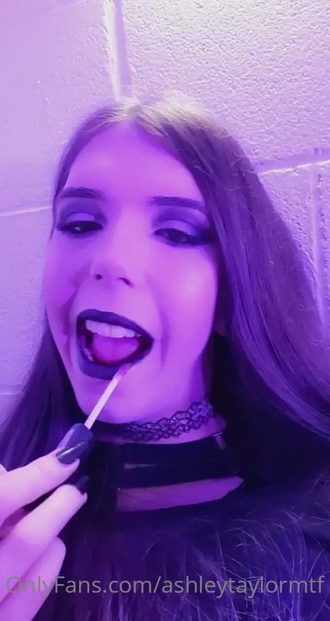 Applying lipgloss to my black lips 