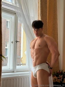 Standing by the window body flexed abs tight and this hard cock