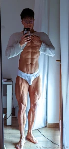 Lifting my shirt showing off these abs while this fat cock strains in