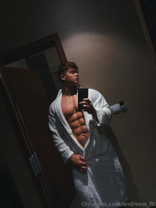 Mirror shot with the robe hanging open abs out just teasing the thick